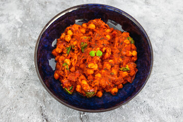 plant-based food, vegan moroccan chickpea stew with tomato sauce onion an carrots