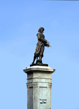 Statue of the Spanish painter Velazquez in Seville, isolated over the blue sky