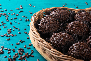 Brigadeiro.Traditional brazilian sweet chocolate in heart shaped basket.