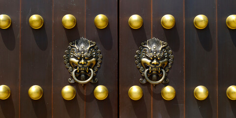 door handle with lion design in buddhist chinese temple door