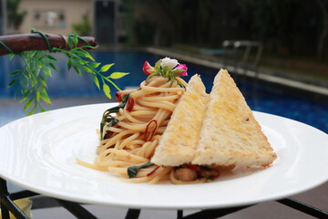 Delicious spaghetti served on a white plate