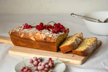 Cupcake. Decorated with red currant berries and powdered sugar