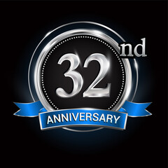 Celebrating 32nd anniversary logo. with silver ring and blue ribbon.