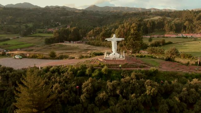 4K daytime before sunset aerial done view over the well known Cristo Blanco statue in the city of Cusco, Peru. Dolly out with a wide angle shot
