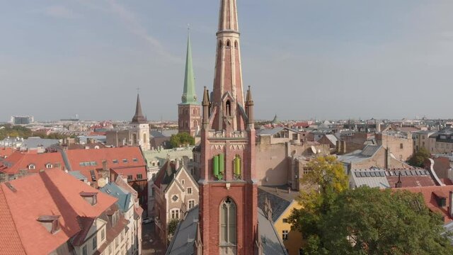 Riga aerial view of St Saviours Anglican church on sunny day, rising above cross tower, Latvia