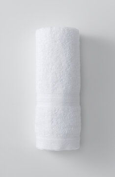 A Towel Placed On A White Background. View From Above