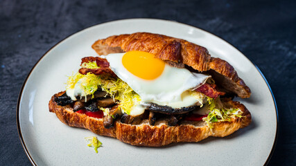Portobello Croissant Breakfast Sandwich with sunny up egg