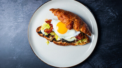 Portobello Croissant Breakfast Sandwich with sunny up egg