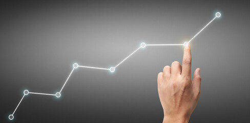 Hand touching a graphs of financial indicator  accounting market economy analysis chart