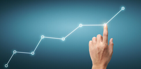 Hand touching a graphs of financial indicator  accounting market economy analysis chart