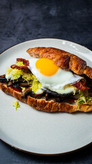 Portobello Croissant Breakfast Sandwich with sunny up egg