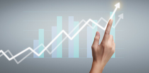 Hand touching a graphs of financial indicator  accounting market economy analysis chart