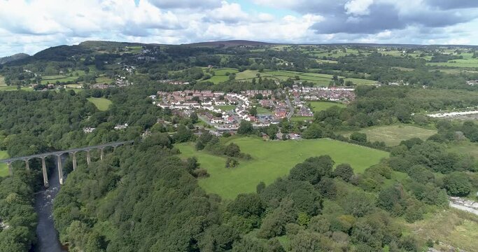 Aerial decent towards Llangollen town towards aqueduct and canal