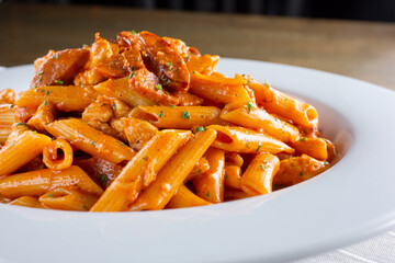 A view of a plate of cajun style pasta.