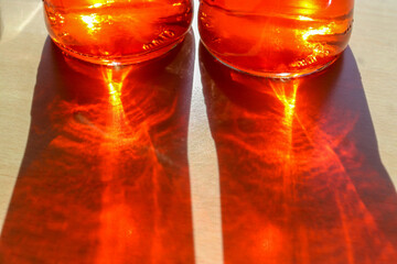 Sunlight shining through a drinking glas showing caustic light e