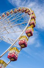 Fototapeta premium Low angle view of a Ferris wheel and gondolas