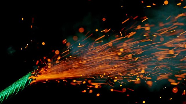 Burning inflammable wick with sparks on black background. Super Slow Motion. Filmed on high speed cinema camera, 1000fps.