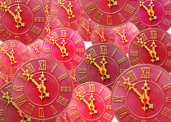 Fototapeta na wymiar Red watch dials with gold arrows 