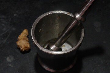 Motor and pestle isolated on black background