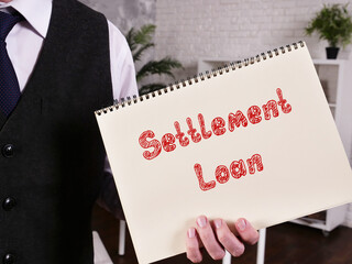 Conceptual photo about Settlement Loan with handwritten phrase.