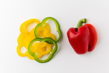 Mixed Colorful raw red yellow green of bell pepper above view on isolated white background. Healthy vegetables and food.