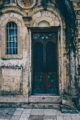 Fototapeta na wymiar Door and window in old medieval stone wall in a Georgian Motsameta Monastery, Kutaisi, Georgia. Unesco world heritage. Famous historical place Imereti.