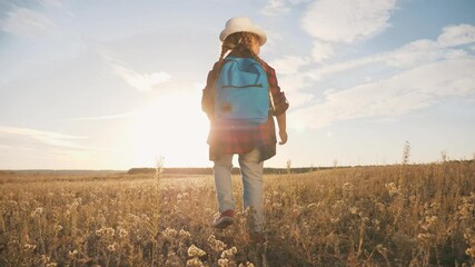 little girl with a teddy bear and a backpack in the park. A cute girl with a backpack and a teddy bear walks across a field with flowers. Lonely Girl Teddy Bear Park Concept Dream Happy Childhood - Powered by Adobe