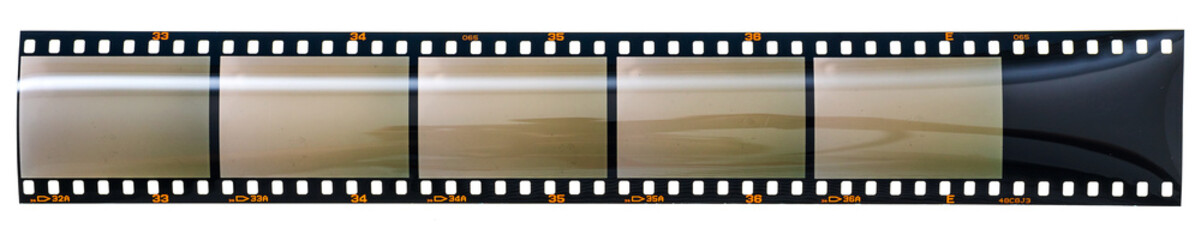 long blank or empty 35mm dia positive film strip or snip on white. nice poster or design element.