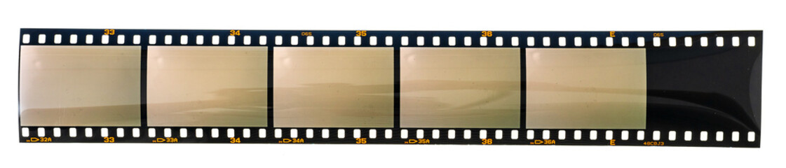 long dia positive 35mm film strip with 6 empty cells or frames on white background.