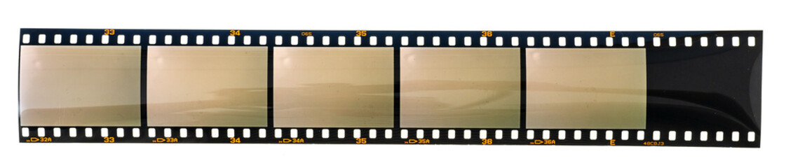 Fototapeta premium long dia positive 35mm film strip with 6 empty cells or frames on white background.