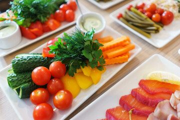 Fresh vegetables cut into strips with sauce and herbs are a treat for guests of the event