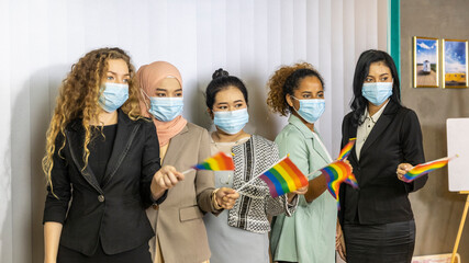 Five business women from different ethnic races and cultures with protective mask express support...