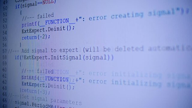 Lines of programmes code run across the white screen. Hacker tries to break security and commit data theft. Closeup