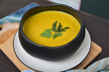 Cream of broccoli soup. Yellow autumn soup for a meal in the middle of the day. Delicious view of the first course.