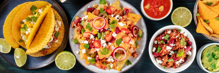 Mexican food panorama. A variety of dishes, overhead shot on a dark blue wooden background