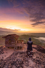 Fototapeta na wymiar Hut and Sunrise at Black Mountain, Yogyakarta Indonesia