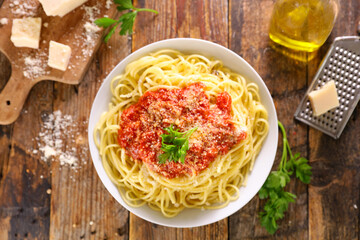 spaghetti with tomato sauce and parmesan