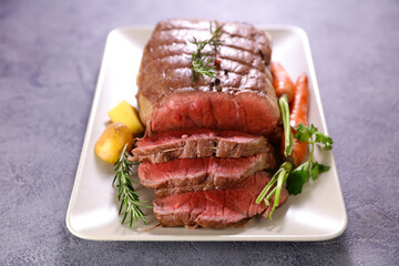 roast beef and slices with carrot, potato and sauce