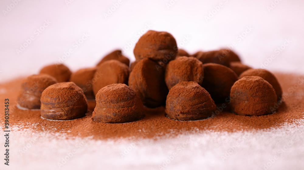 Sticker heap of chocolate truffes and cocoa