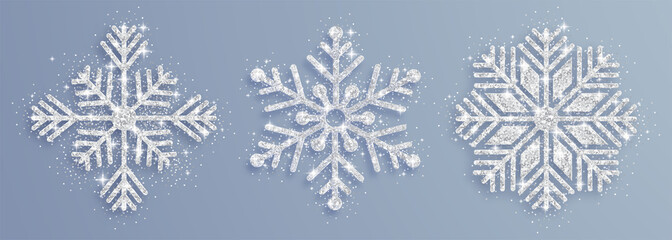 Vector illustration of snowflakes with silver glittering texture. New year and Christmas design elements