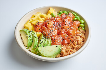 Poke salad with salmon, avocado, mango, edamame, crispy onion and sesame seeds