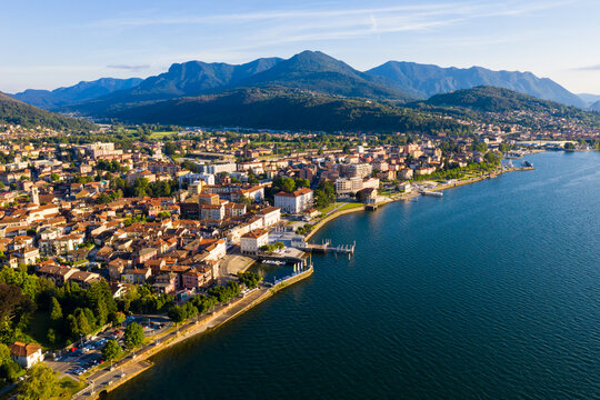 View from drone of summer Luino cityscape and Lake Maggiore, province of Varese, Lombardy, northern Italy