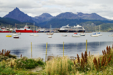 Modern cruise ship, cruiseship liner or expedition vessel ship in port of Ushuaia, Argentina with...