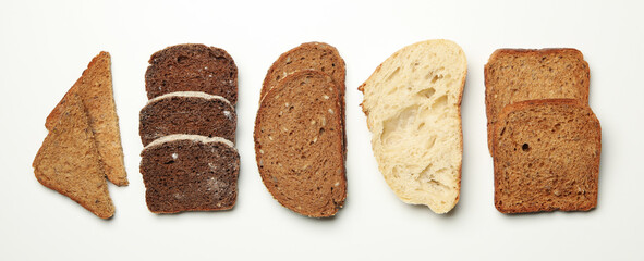 Different bread slices on white background, space for text