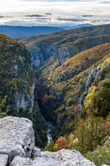 Fototapeta na wymiar vieww of Vikos Gorge, the deepest gorge in Europe, with fall colors near tsepelovo in Zagori Epirus, Greece.