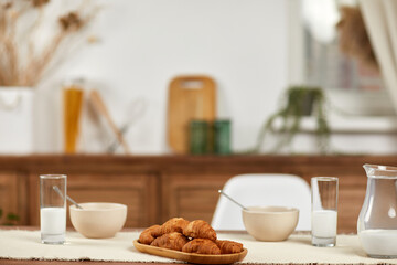 breakfast with fresh delicious croissants and milk in the morning in kitchen