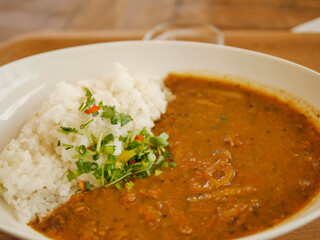 The curry rice is placed in a white plate. Japanese food.