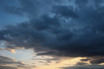 Beautiful sunset sky above clouds with dramatic light