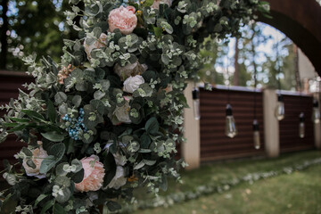 light bulbs on round wedding arch for ceremony