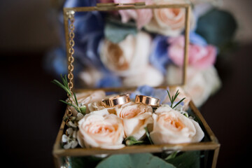 wedding gold rings in a transparent box